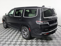 Driving our luxurious 2022 Jeep Grand Wagoneer Series I 4X4 in Diamond Black Crystal Pearl is a grea... (image 7)