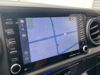 The 2021 Toyota Tacoma TRD, available at Wheaton Chevrolet in Red Deer, is a rugged, 4WD pickup truc... (image 6)