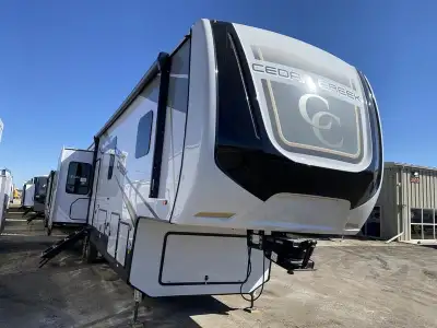 This mid-bunk model gives you a bonus room off the kitchen that functions as a bedroom with a fold-d...
