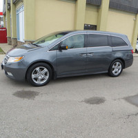 This One Owner 2011 Honda Odyssey Touring Elite is a spacious and reliable van-minivan, perfect for... (image 1)
