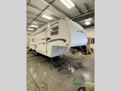 This fifth wheel weighs 7100lbs and features one slide, front queen bedroom, bright bathroom with sh...