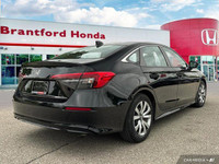 This 2022 Honda Civic Sedan LX boasts a sleek black exterior and a surprisingly spacious interior, p... (image 5)