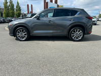 This 2021 Mazda CX-5 Signature has a Grey Exterior and Brown Interior with seating for 5. Equipped w... (image 2)