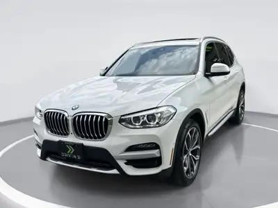 Embrace the elegance of the 2021 BMW X3 xDrive30i, a striking white Sports Activity Vehicle that per...