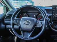 CAMRY XSE FEATURES AWD, 19-INCH WHEELS, AND DUAL EXHAUST. INSIDE, IT OFFERS A LEATHER-TRIMMED INTERI... (image 9)
