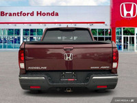 This 2019 Honda Ridgeline Touring Crew Cab Pickup boasts a powerful engine and a luxurious interior,... (image 4)