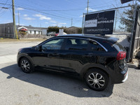 Check out this stylish 2019 Kia Niro EX Premium SUV! With a sleek black exterior and interior, this... (image 1)