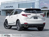 CLEAN CARFAX, LOW KM Glazed in a White Diamond Pearl exterior that is completed with Red leather w/... (image 4)