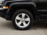 The 2015 Jeep Patriot North is a compact SUV known for its rugged off-road capability, stylish desig... (image 9)