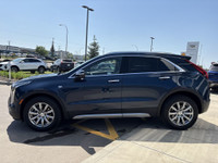 Finished in Twilight Blue Metallic and riding on stylish 18-inch aluminum wheels, this 2021 Cadillac... (image 4)