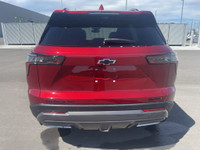 The 2025 Chevrolet Equinox ACTIV, dressed in a bold Radiant Red exterior with a distinctive Maple Su... (image 7)