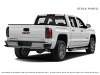 Powerful presence meets sophisticated comfort in the 2018 GMC Sierra 1500 SLT, graced with a Dark Sl... (image 5)