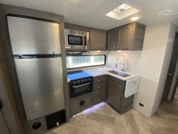 East to West Alta with bunkroom! This trailer features 2 slides, one in the main living area and ano... (image 8)