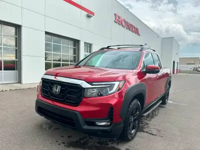 Our 2023 Honda Ridgeline Touring in Radiant Red Metallic is a local lease return! Call to book an ap...