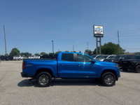 The 2023 Chevrolet Colorado 4WD LT Crew Cab in a striking blue finish offers impeccable handling wit... (image 4)