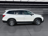 This well-equipped three-row SUV adds premium features like leather-trimmed seating, integrated navi... (image 8)