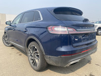 Under the glistening Rhapsody Blue exterior, the 2019 Lincoln Nautilus Reserve stands as a testament... (image 4)