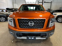 Take on your day in style with our 2019 Nissan Titan PRO-4X Crew Cab 4X4 shown off in Habanero Orang... (image 7)