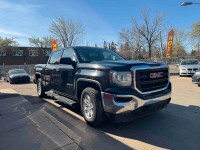 The 2018 GMC Sierra 1500 LT Crew Cab in black is a full-size pickup that combines rugged capability... (image 1)