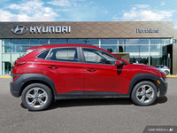 This 2022 Hyundai Kona Preferred SUV boasts a vibrant Pulse Red exterior and a sleek black interior.... (image 5)