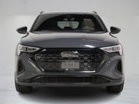 This 2024 Audi Q8 e-tron blends all-electric power with refined luxury, finished in a sleek dark gre... (image 5)