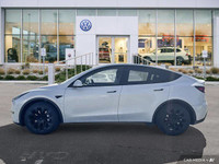 This Tesla Model Y delivers a Electric engine powering this Automatic transmission. Window Grid Ante... (image 1)