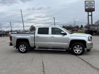 This striking Silver 4×4 GMC Sierra 1500 SLT is the ultimate harmonization of power, style, and comf... (image 4)