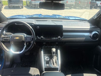 The 2023 Chevrolet Colorado 4WD LT Crew Cab in a striking blue finish offers impeccable handling wit... (image 9)
