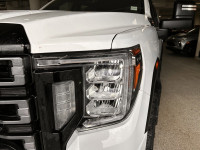 Drive our used Diesel powered 2021 GMC Sierra 2500 AT4 Crew Cab standard box 4X4 in Summit White and... (image 8)