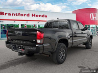 Conquer any terrain with this 2020 Toyota Tacoma Crew Cab Pickup, boasting a rugged Magnetic Grey Me... (image 5)
