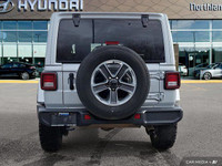 This 2023 Jeep Wrangler Sahara, a head-turner in Silver Zynith, offers both rugged capability and re... (image 3)