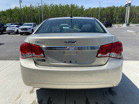 The 2014 Chevrolet Cruze 1LS offers a practical and efficient driving experience in a compact sedan.... (image 6)