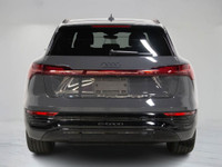 This 2024 Audi Q8 e-tron blends all-electric power with refined luxury, finished in a sleek dark gre... (image 4)