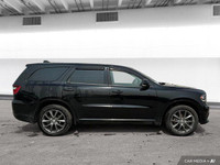 The 2018 Dodge Durango offers leather-faced bucket seats, heated front and rear seats, a heated stee... (image 6)