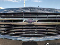 The 2021 Chevrolet Tahoe RST in black with a confident 4 4 drivetrain combines robust power and resp... (image 9)