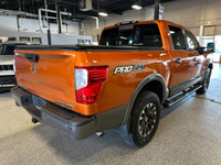 Take on your day in style with our 2019 Nissan Titan PRO-4X Crew Cab 4X4 shown off in Habanero Orang... (image 4)