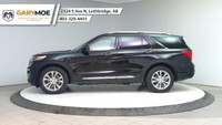 The 2024 Ford Explorer Limited 4WD in sleek black is a robust yet stylish SUV designed to conquer bo... (image 1)