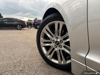 Experience effortless elegance with this 2016 Lincoln MKZ. Boasting a sleek silver exterior and a me... (image 9)