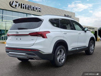 Experience the 2023 Hyundai Santa Fe Preferred SUV, boasting a stunning Quartz White exterior and bl... (image 4)