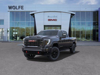 The 2025 GMC Sierra 2500HD AT4, presented in Titanium Rush Metallic with a Jet Black/Kalahari interi... (image 3)