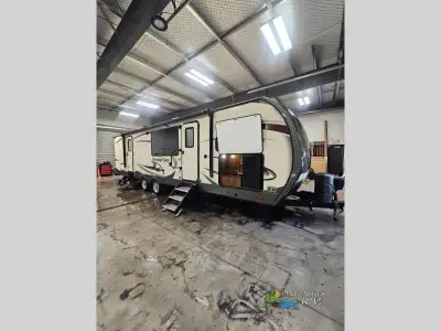A front kitchen, dual entry, a custom king bed, and double slides are just a few of the features tha...