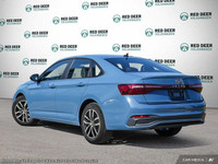 The 2025 Volkswagen Jetta Comfortline is a stunning blue sedan that offers a smooth driving experien... (image 3)