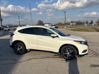 Elevate your driving experience with the striking White Honda HR-V Sport, featuring an All-Wheel Dri... (image 4)
