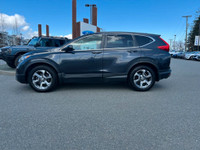 This 2018 Honda CRV EX-L has a Grey Exterior and Black Interior with seating for 5. Equipped with a... (image 1)