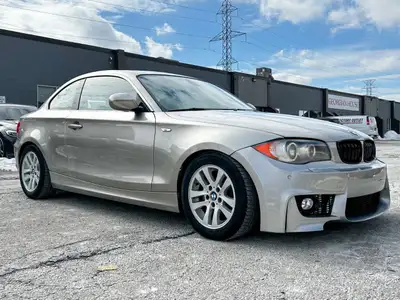 VIN: WBAUP7C52BVM54671 Engine: 3L 6-Cyl Mileage: 144612 km Exterior Color: Tan Interior Color: Black...