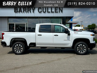 The 2025 Chevrolet Silverado 2500HD Custom in pristine white with a robust 44 drivetrain is designed... (image 2)