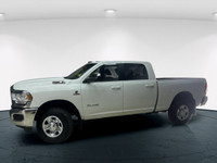 The 2020 Ram 2500 Big Horn in a classic white exterior and rugged 4x4 drivetrain promises unparallel... (image 2)