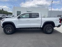 The 2025 Chevrolet Colorado ZR2, presented in Summit White with a Jet Black/Artemis interior, is eng... (image 4)