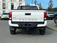 This 2018 Toyota Tacoma has a White exterior and Grey interior with seating for 5. Equipped with a 3... (image 4)