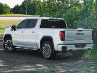 The *2023 GMC Sierra 1500 Denali Ultimate* is a pre-owned powerhouse that effortlessly blends bold d... (image 6)